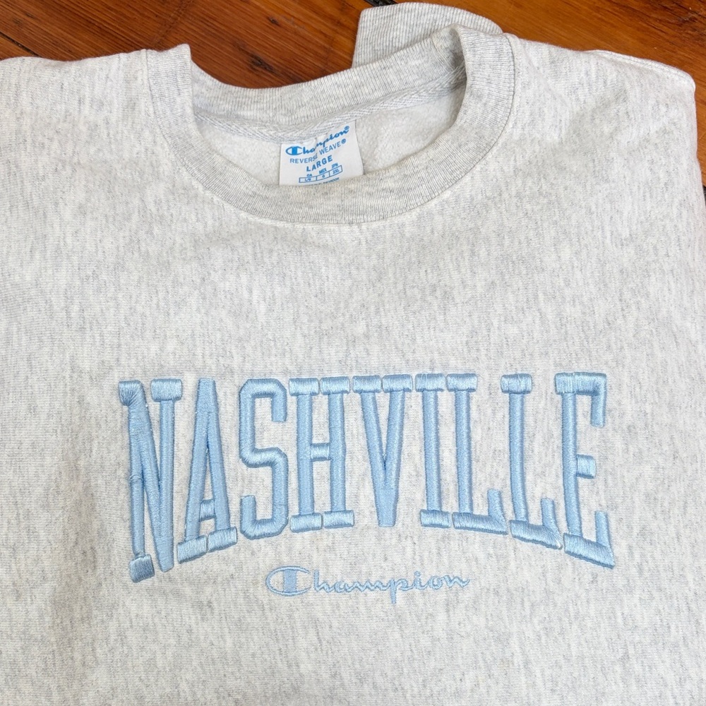 Champion Light Gray Crewneck Sweatshirt with Light Blue "Nashville" Embroidery